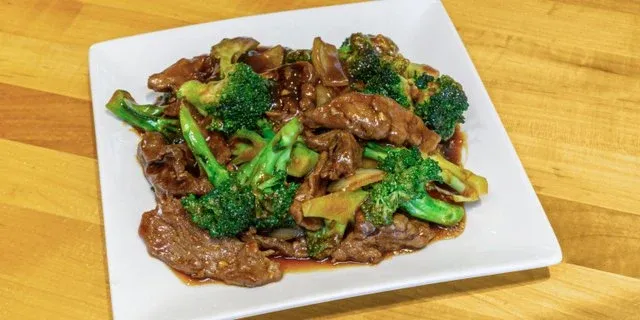 Beef and broccoli on a white plate at Mo’s Chinese #2